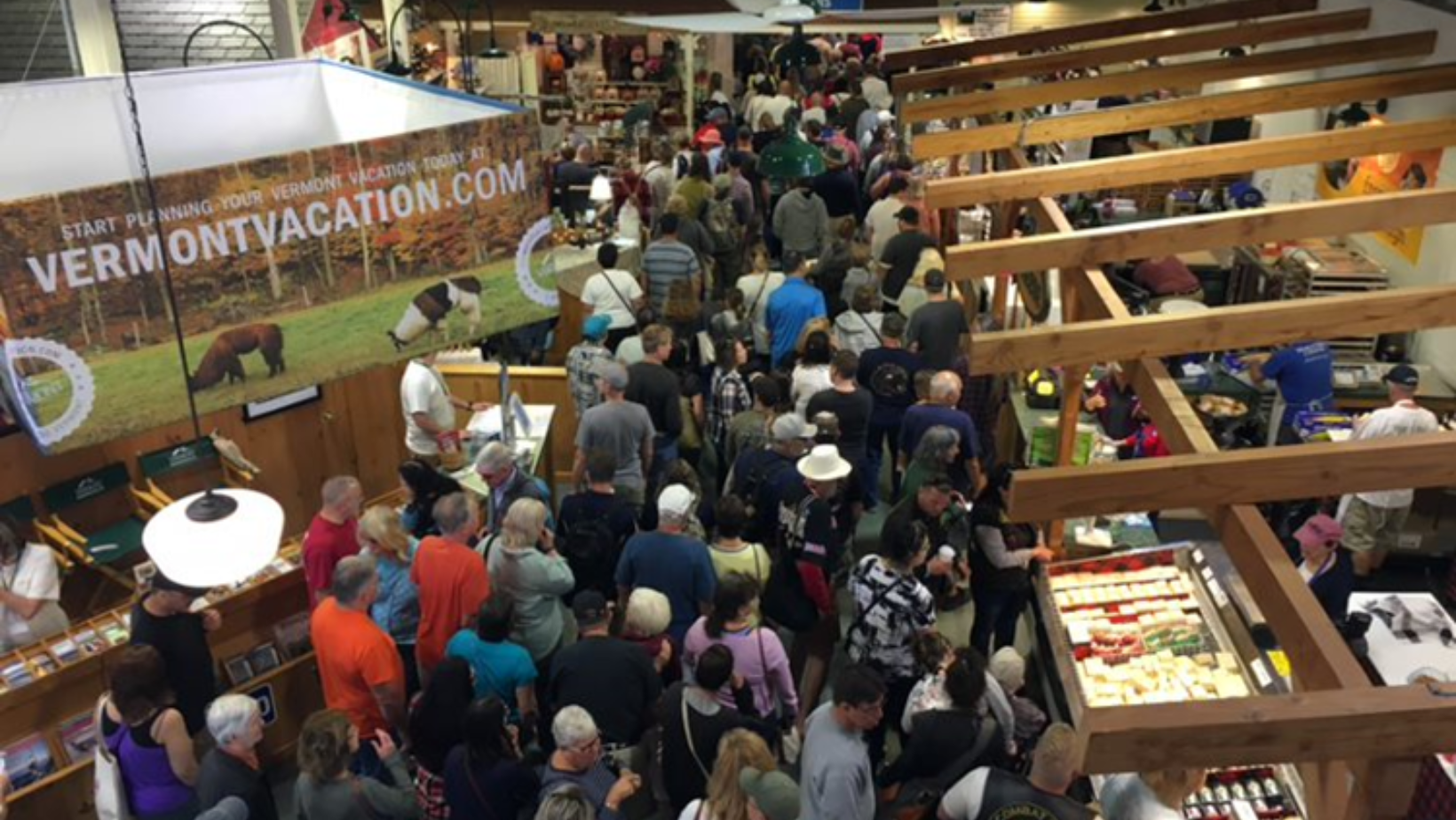 A large crowd passes through the Vermont Building at the Big E.