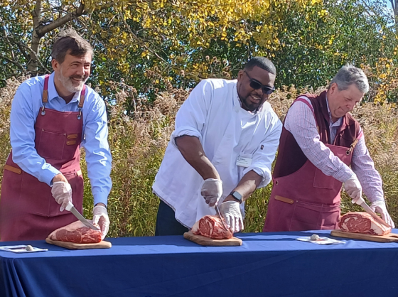  VTSU President Berge, Demetris Reed , and Secretary Anson Tebbetts perform "Rib-Eye Cutting " Ceremony at the Launch of the Meat Processing & Agricultural Education Hub at VTSU Randolph